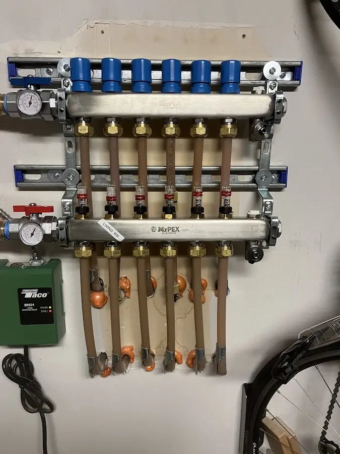 Plumber performing Water Heater Repair at a residential property in Dingman